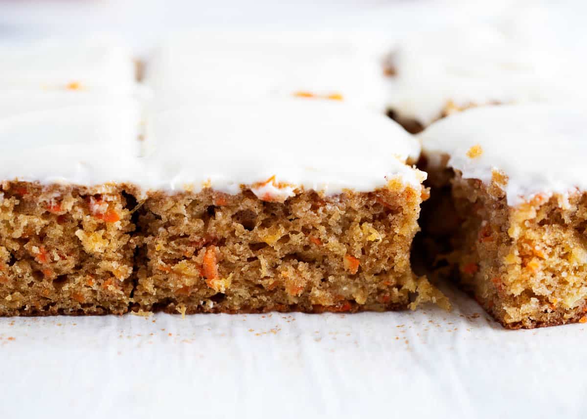 Carrot cake sliced into pieces. 