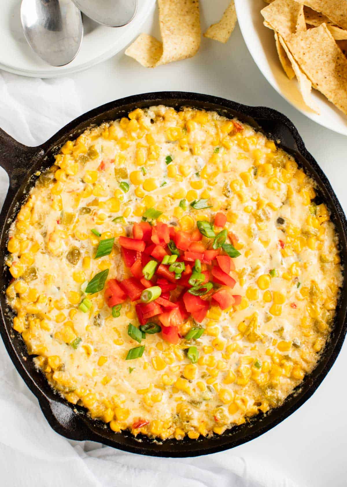 Corn dip in a cast iron skillet.