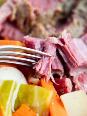 Corned beef and cabbage on a plate.
