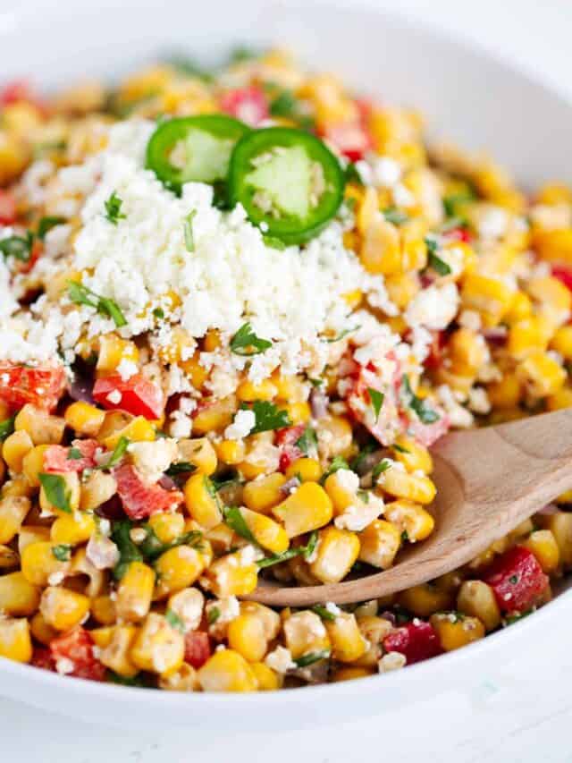 Mexican corn salad in a white bowl.