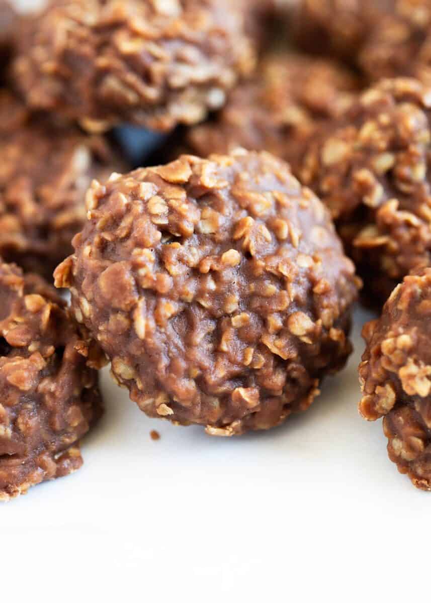 No-Bake Cookies - Only 7 ingredients and 15 minutes to make! Perfectly soft and chewy with a delicious chocolate peanut butter taste. No bake cookies on a white plate.