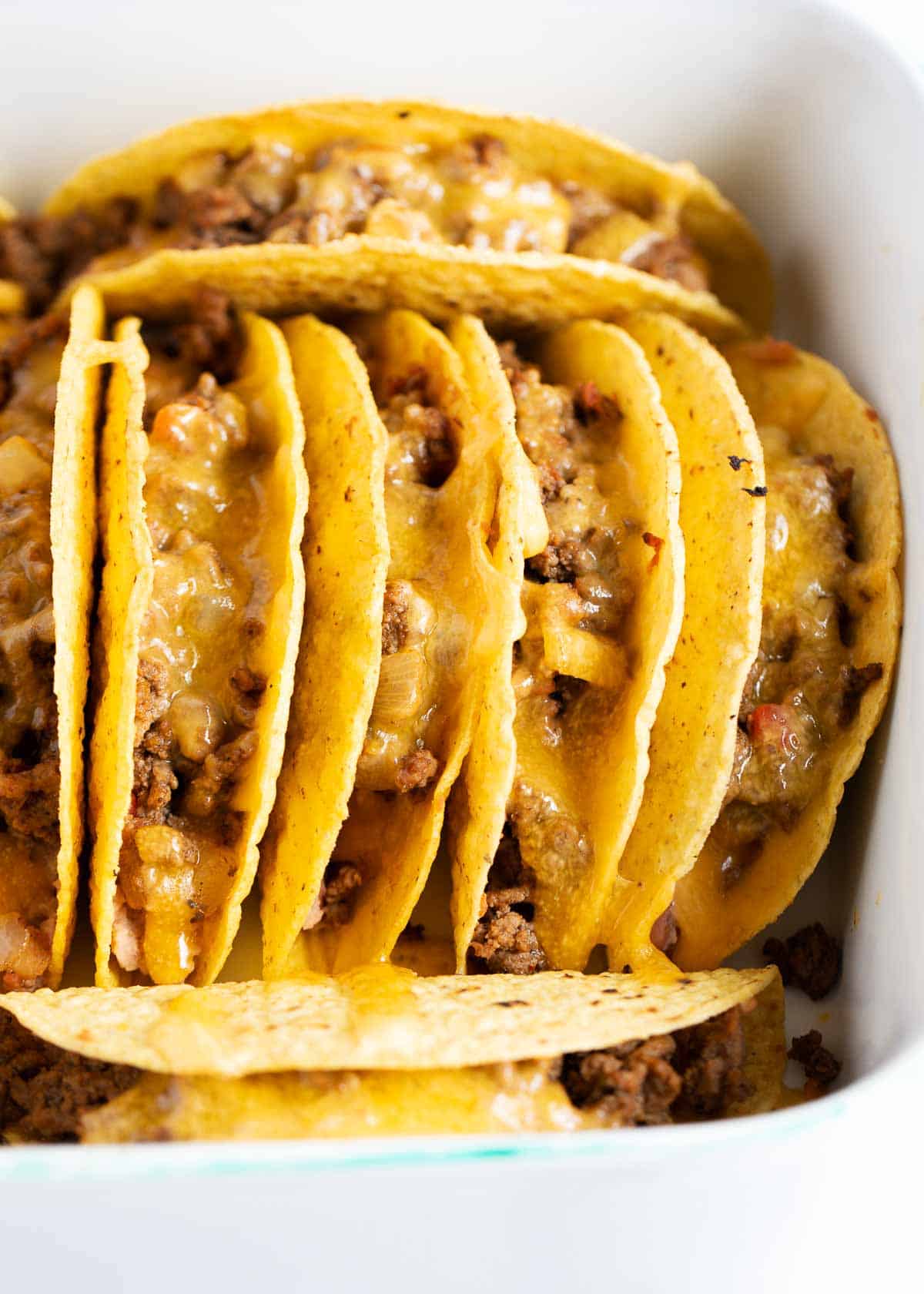 Ground beef tacos with cheese.