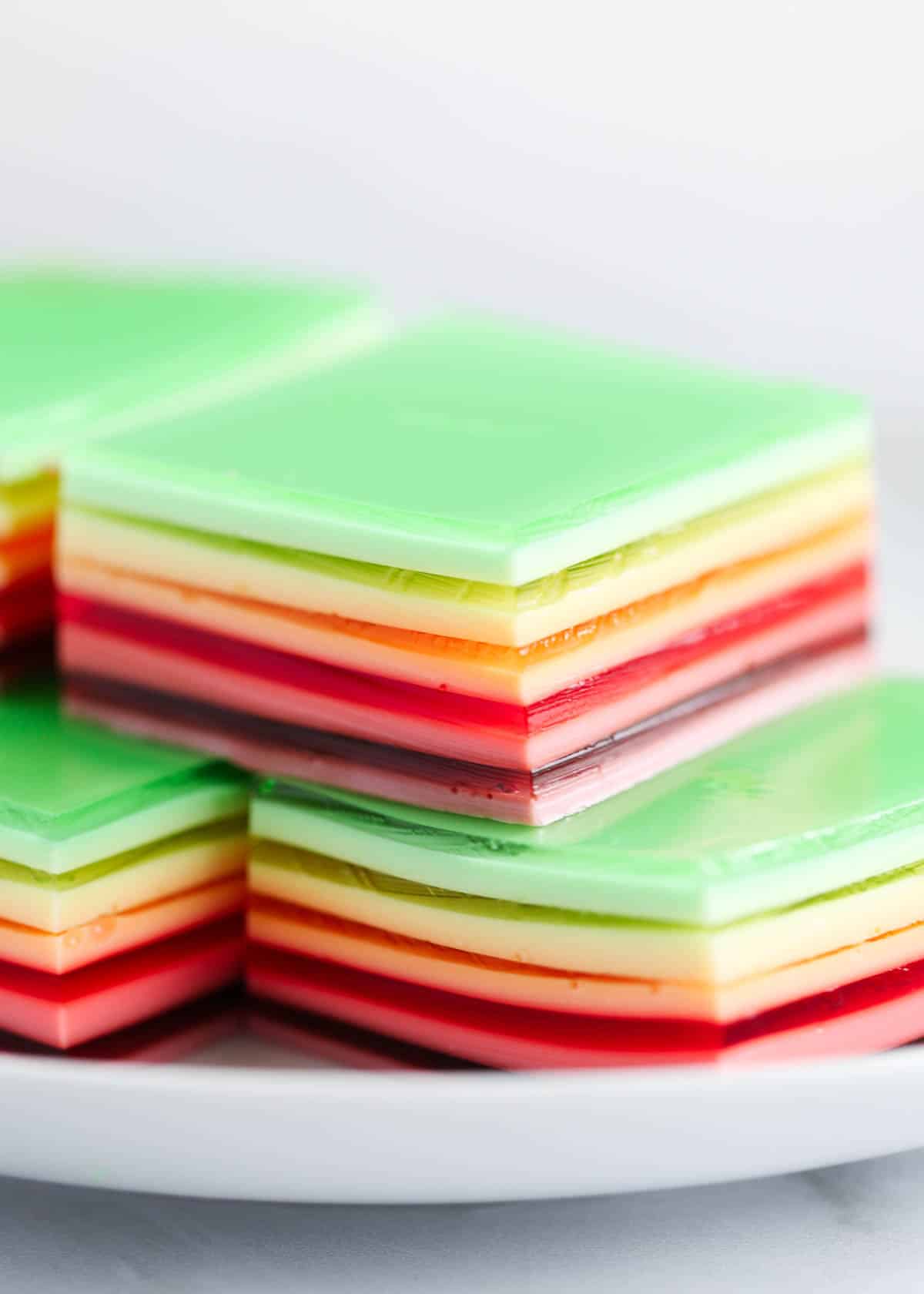 Rainbow jello stacked on top of each other. 