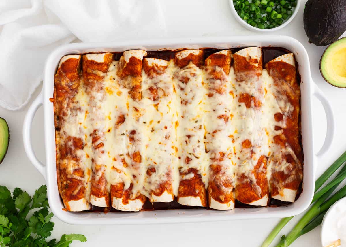 Beef enchiladas on a white countertop.