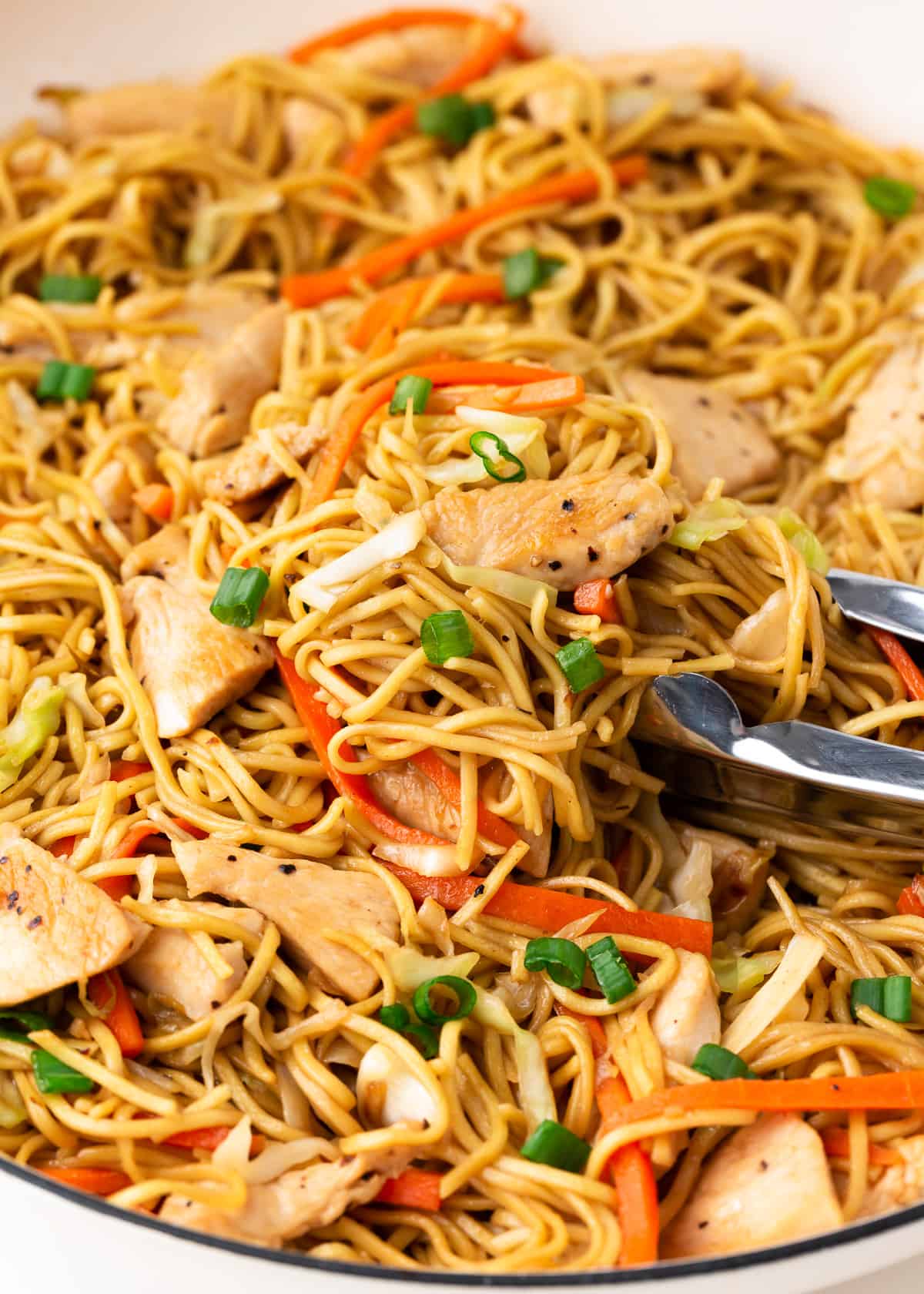 Chicken chow mein in a skillet.