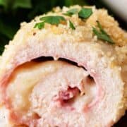 A piece of chicken cordon bleu on a plate.