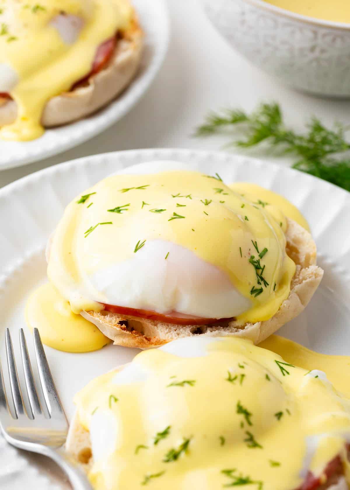 Eggs Benedict on a white plate.