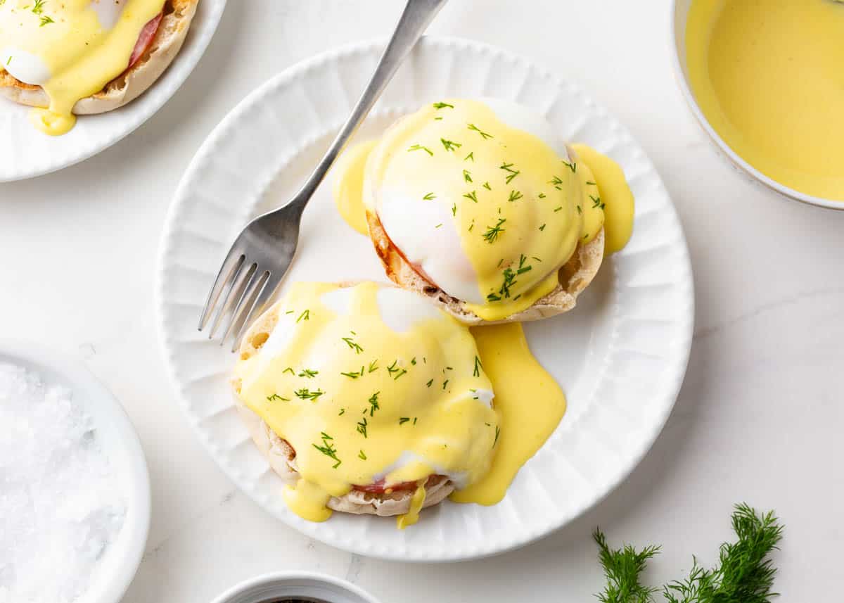 Eggs Benedict on a white plate.