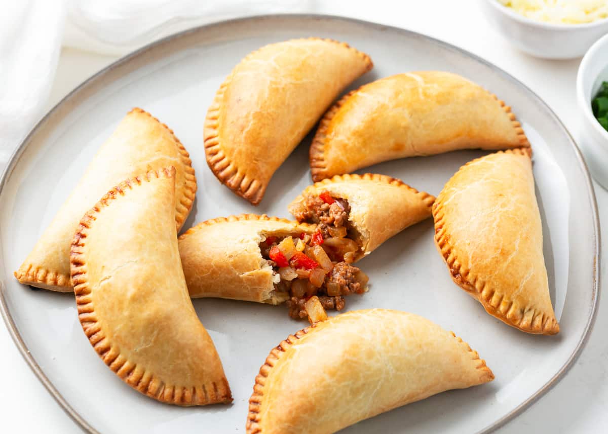 Empanadas on a white plate.