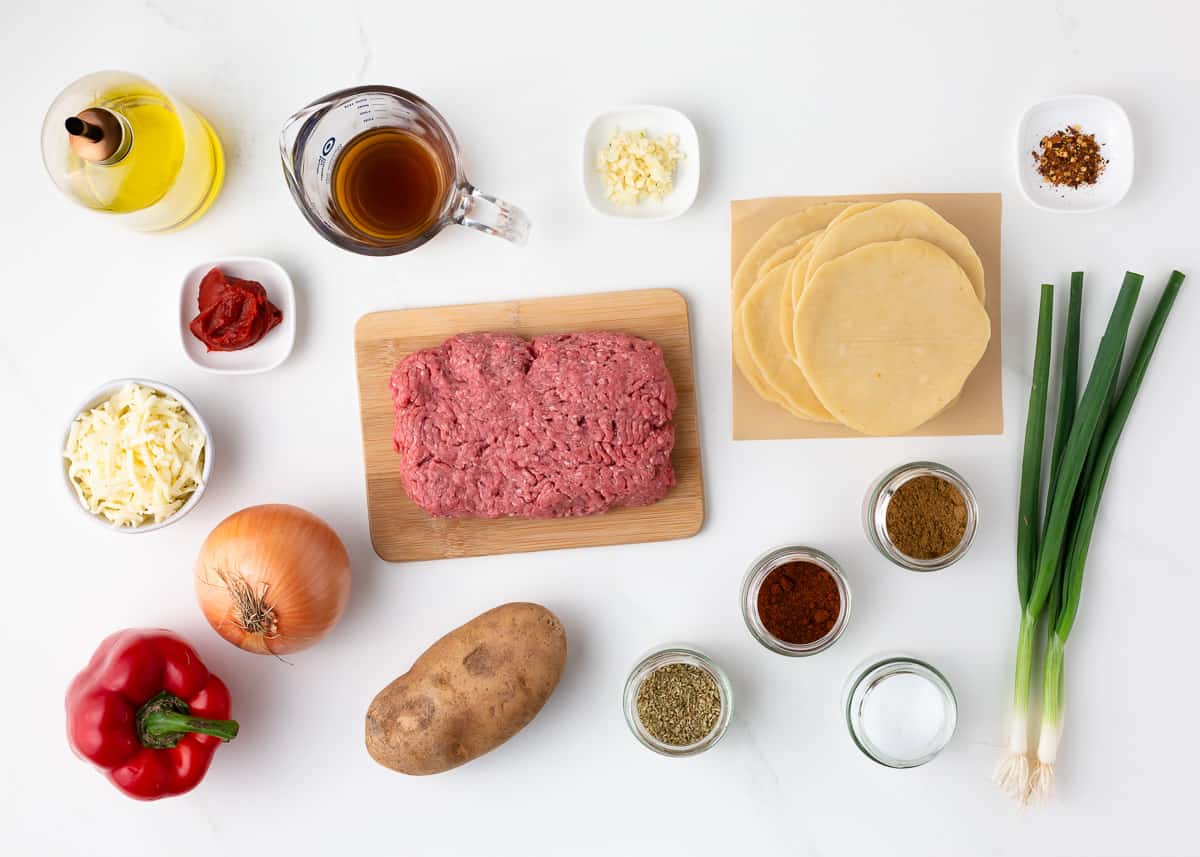 Empanadas ingredients on counter.