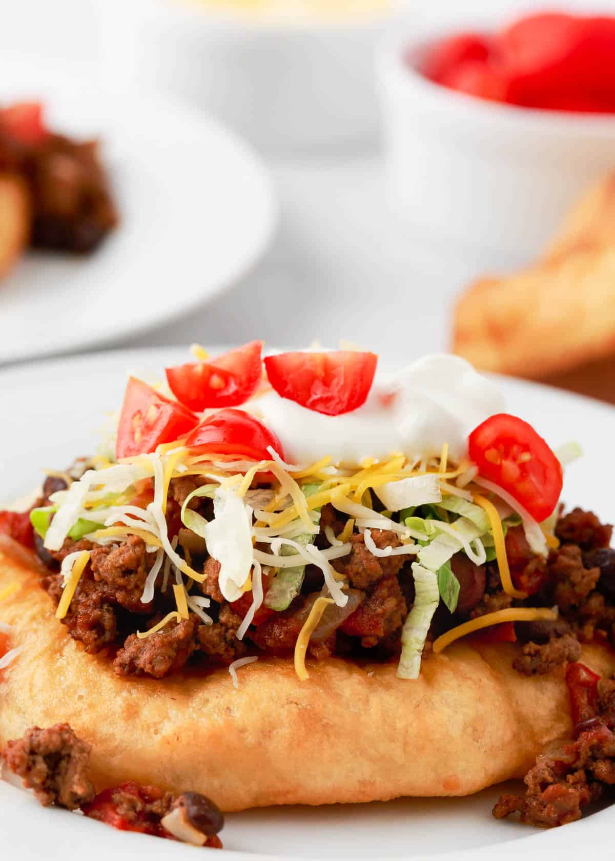 Navajo tacos on a white plate. 