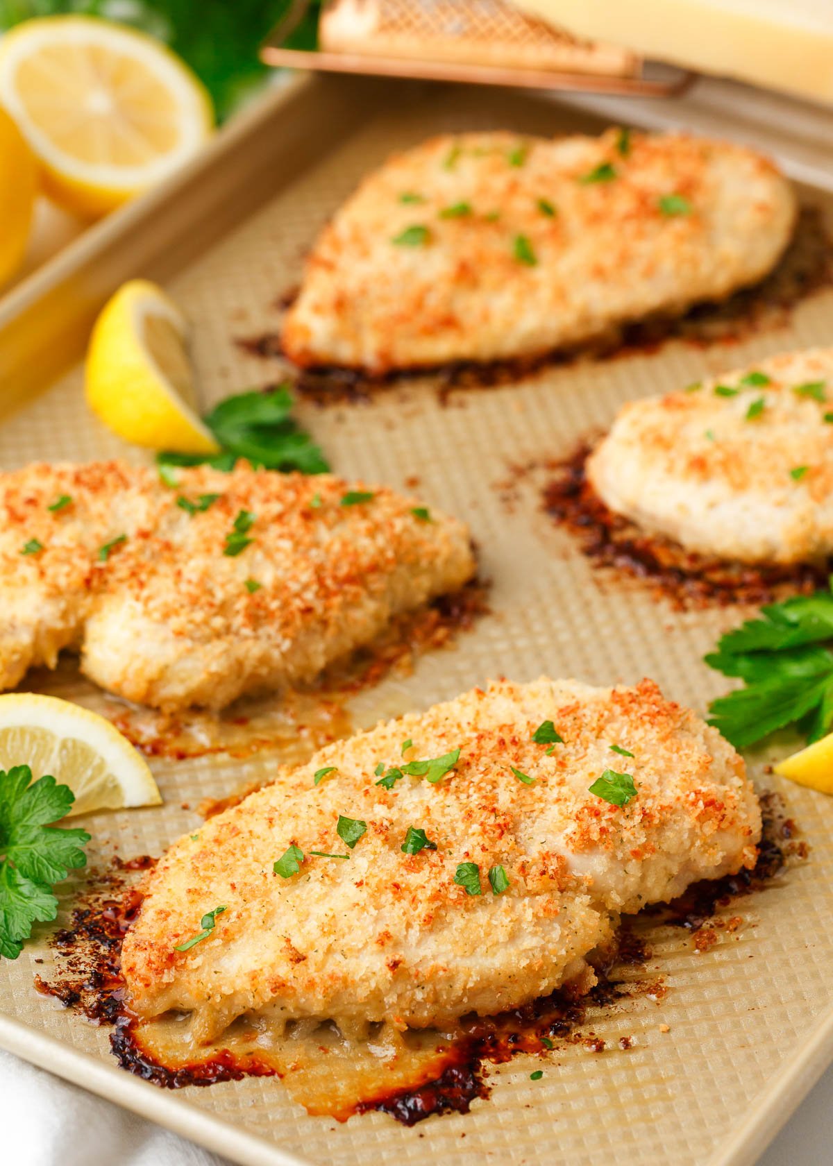 Cooked ranch chicken on baking sheet.