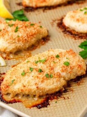 Cooked ranch chicken on baking sheet.
