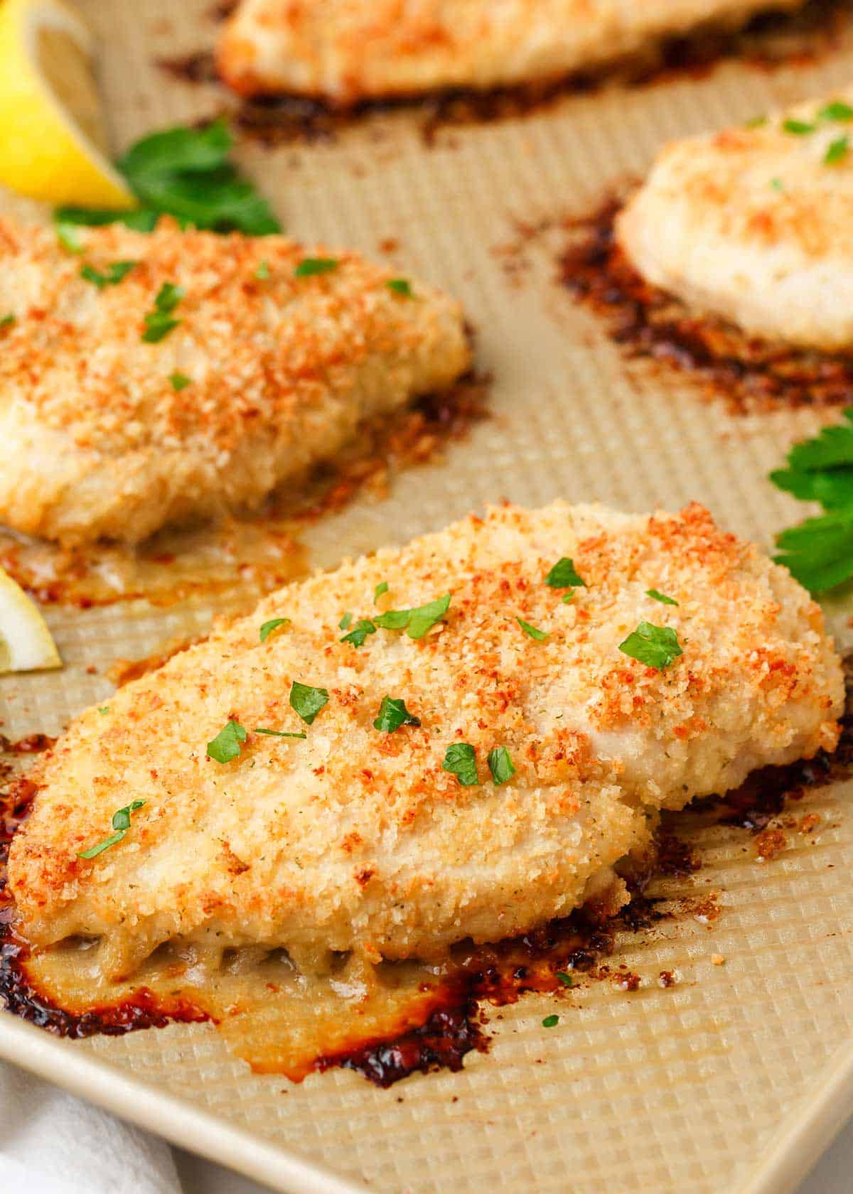 Cooked ranch chicken on baking sheet.