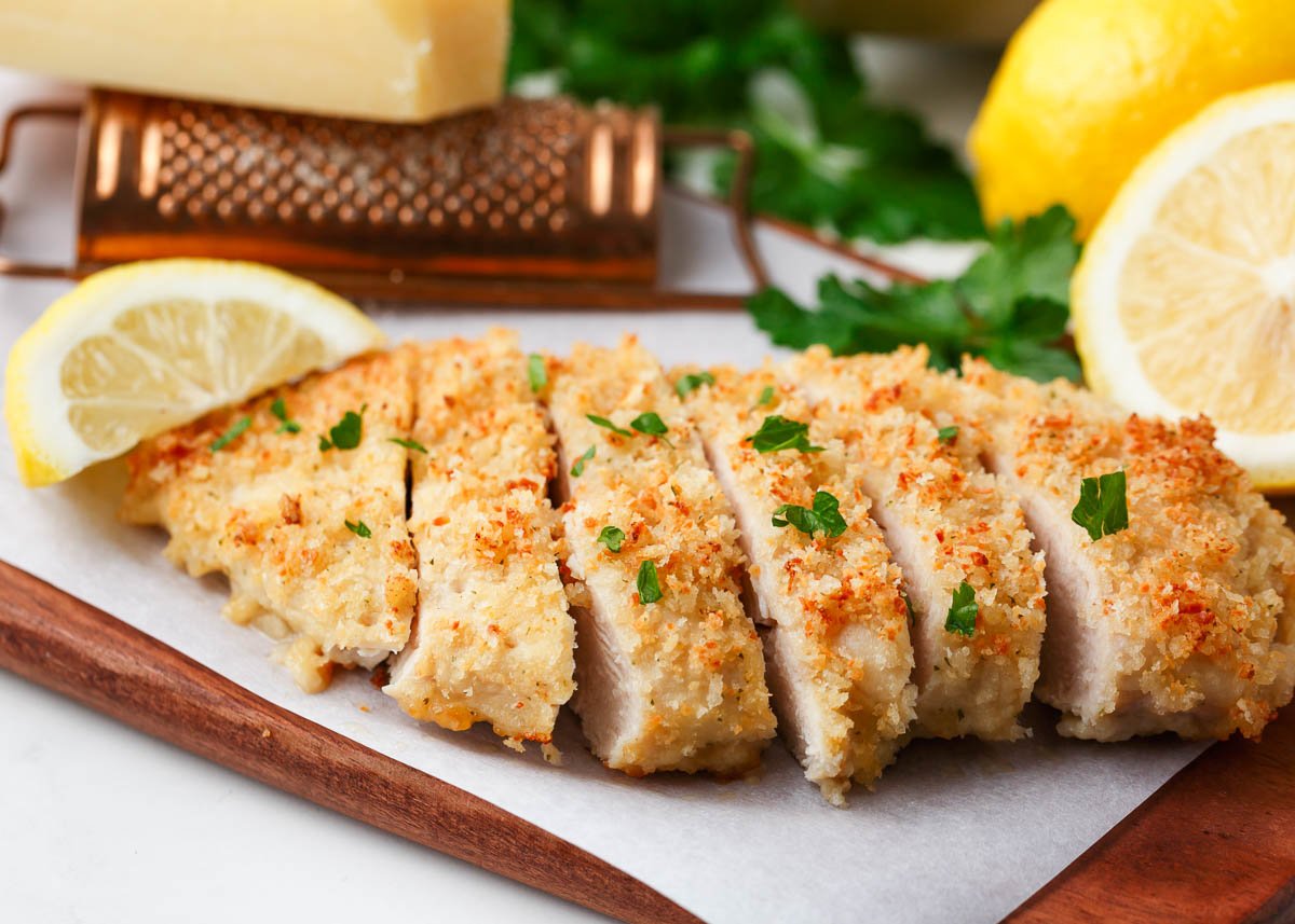 Sliced ranch chicken on cutting board.