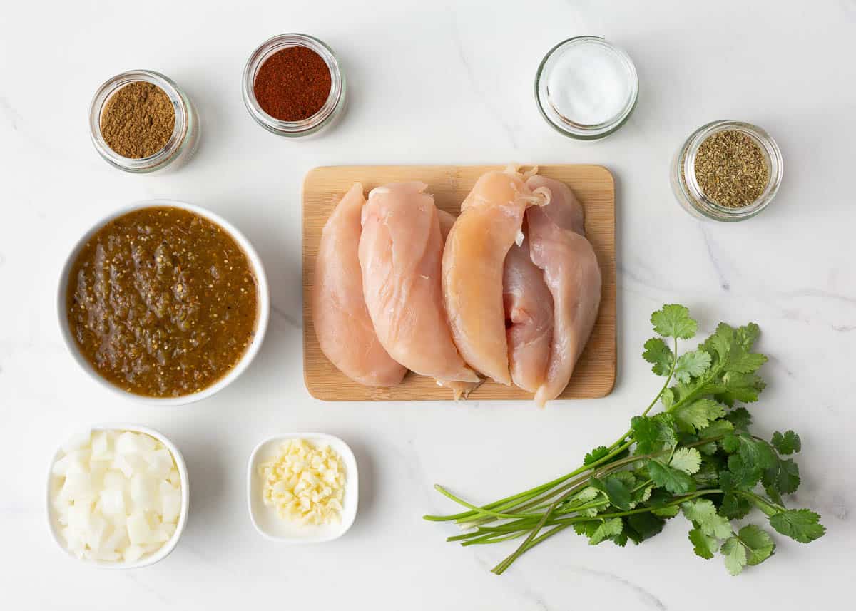 Salsa verde chicken ingredients on counter.