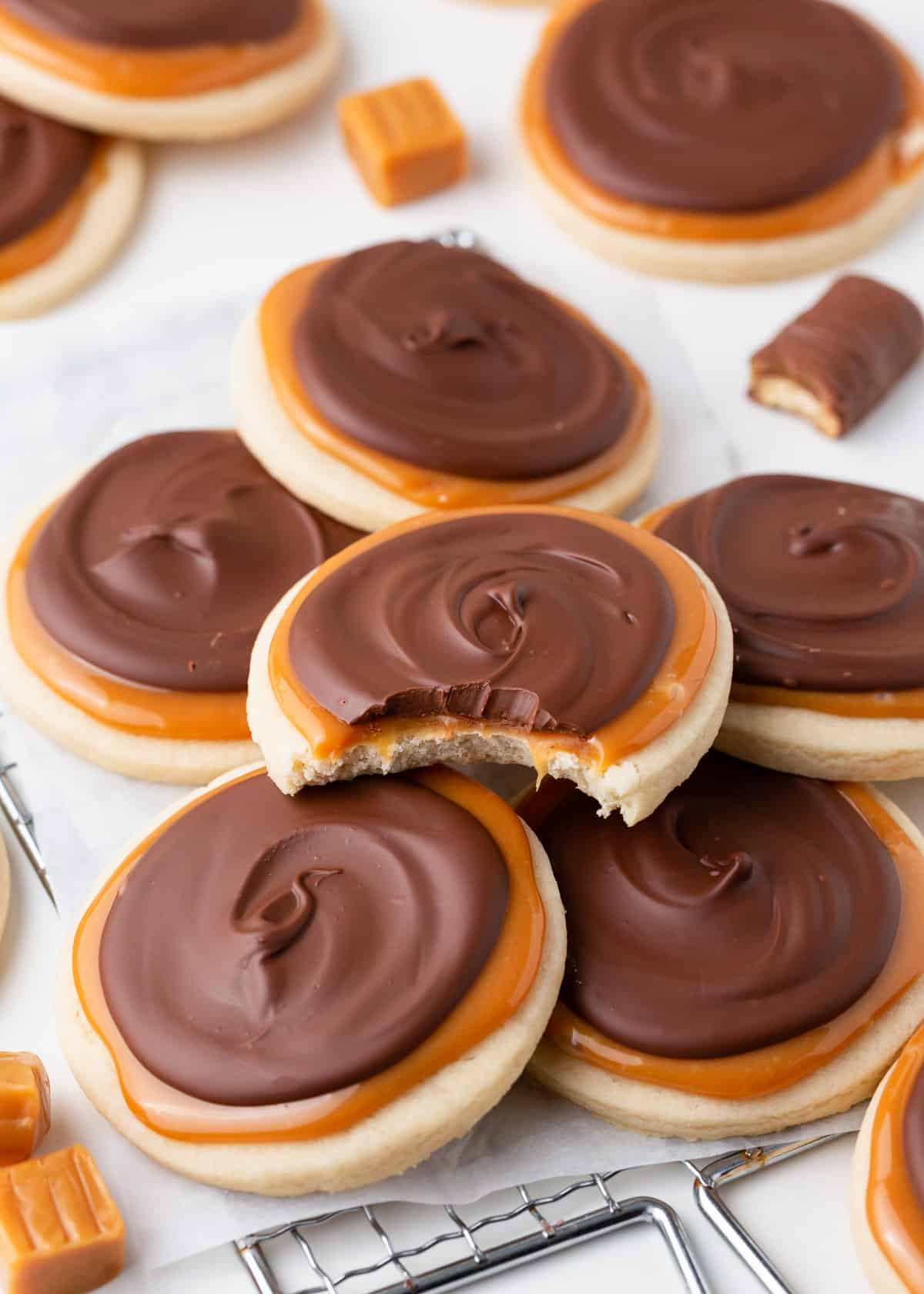 Twix cookies stacked on cookie rack.