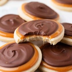Twix cookies piled on top of each other on the counter.