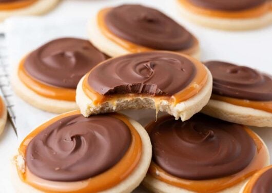 Twix cookies piled on top of each other on the counter.