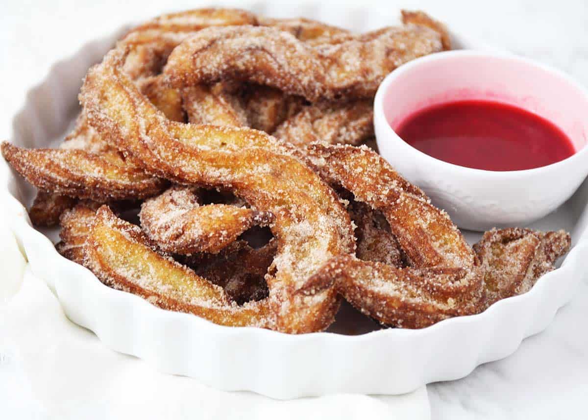Churros on a white plate.