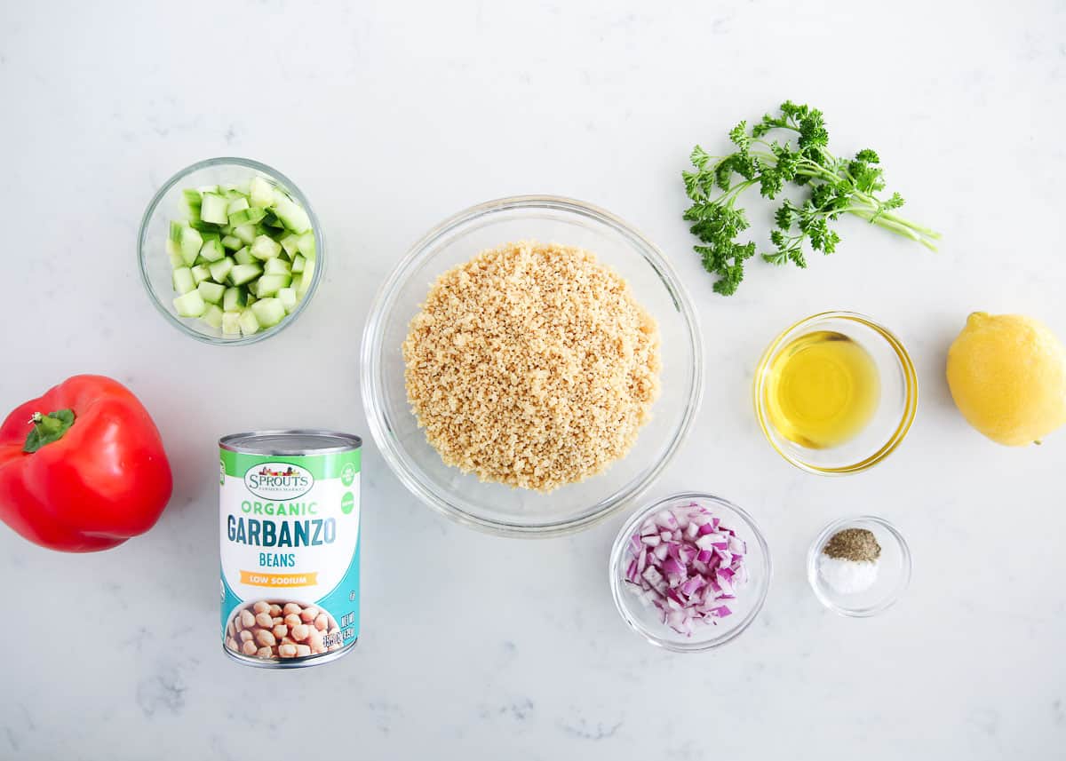 Couscous ingredients on a marble counter.