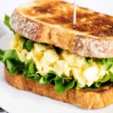 Egg salad sandwich on a plate.