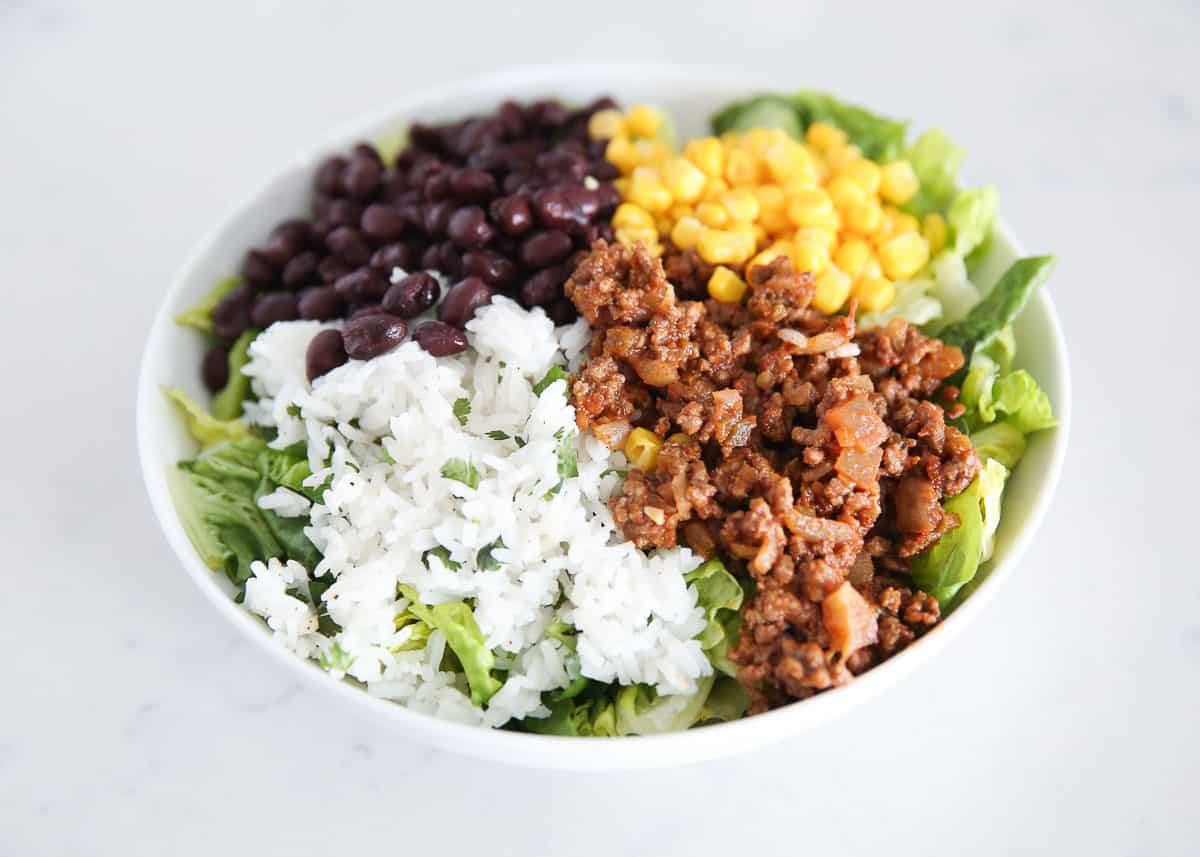 Showing how to make a taco salad.