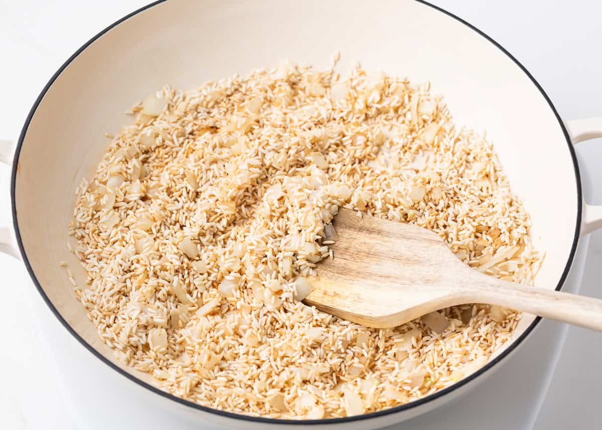 Toasting rice in a skillet.