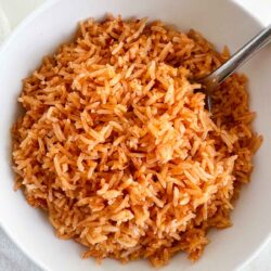 Mexican rice in a bowl with spoon.