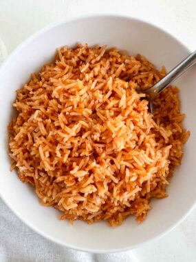 Mexican rice in a bowl with spoon.