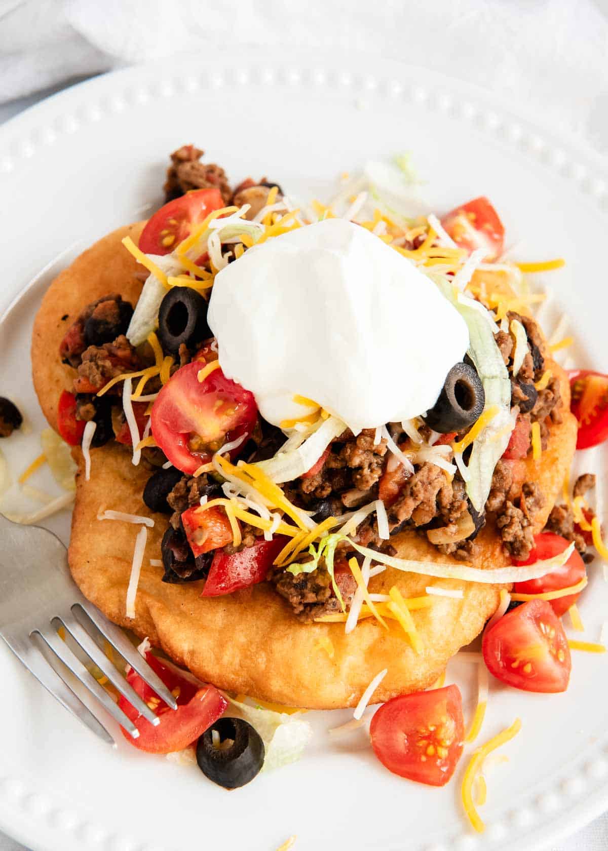Overhead photo of the Navajo taco on a white plate. 