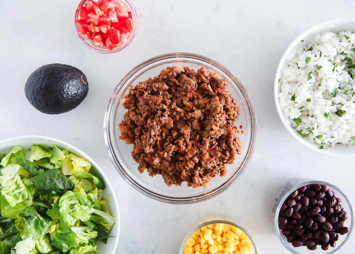 Taco salad ingredients on counter.