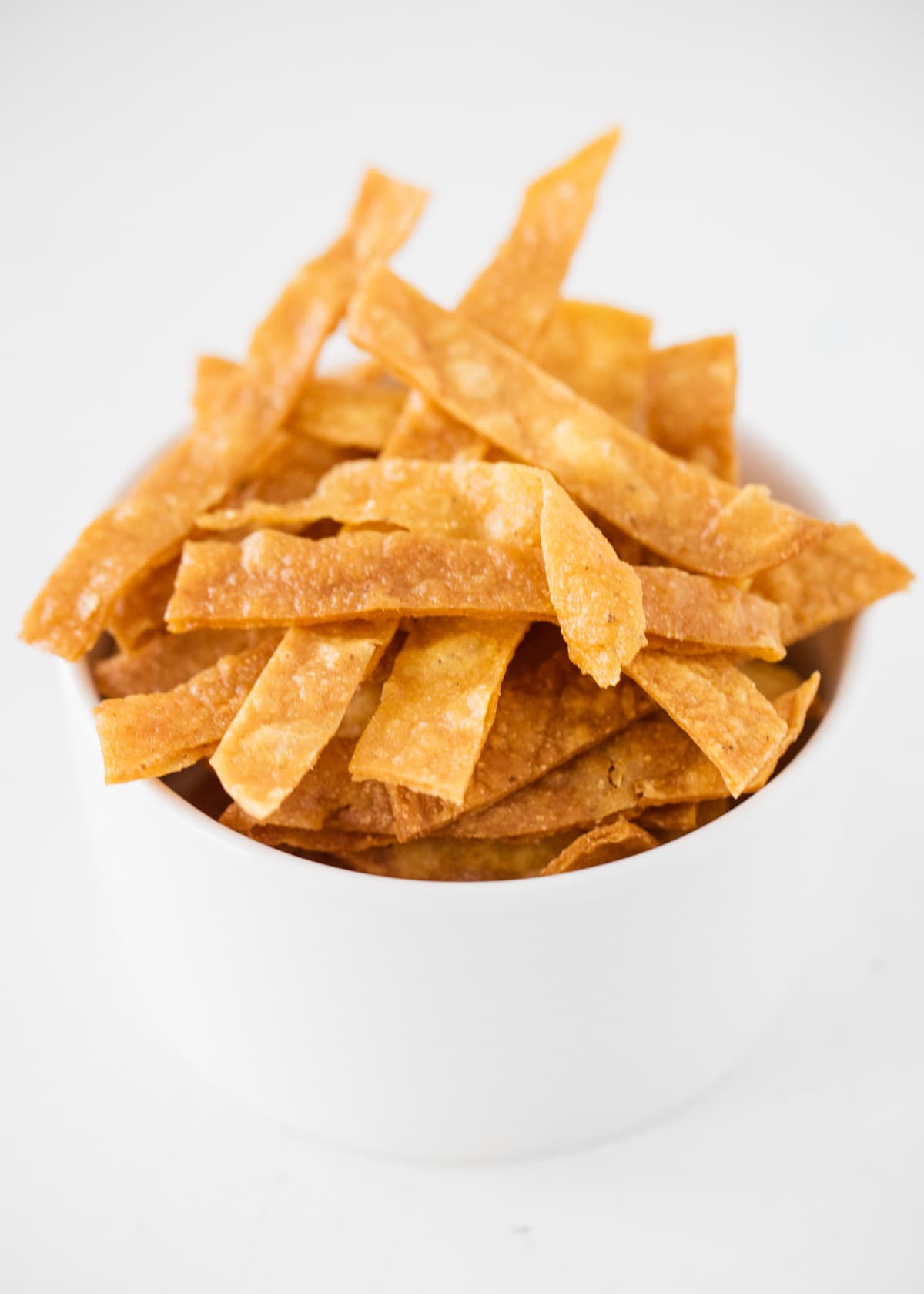 Homemade tortilla strips in a bowl. 