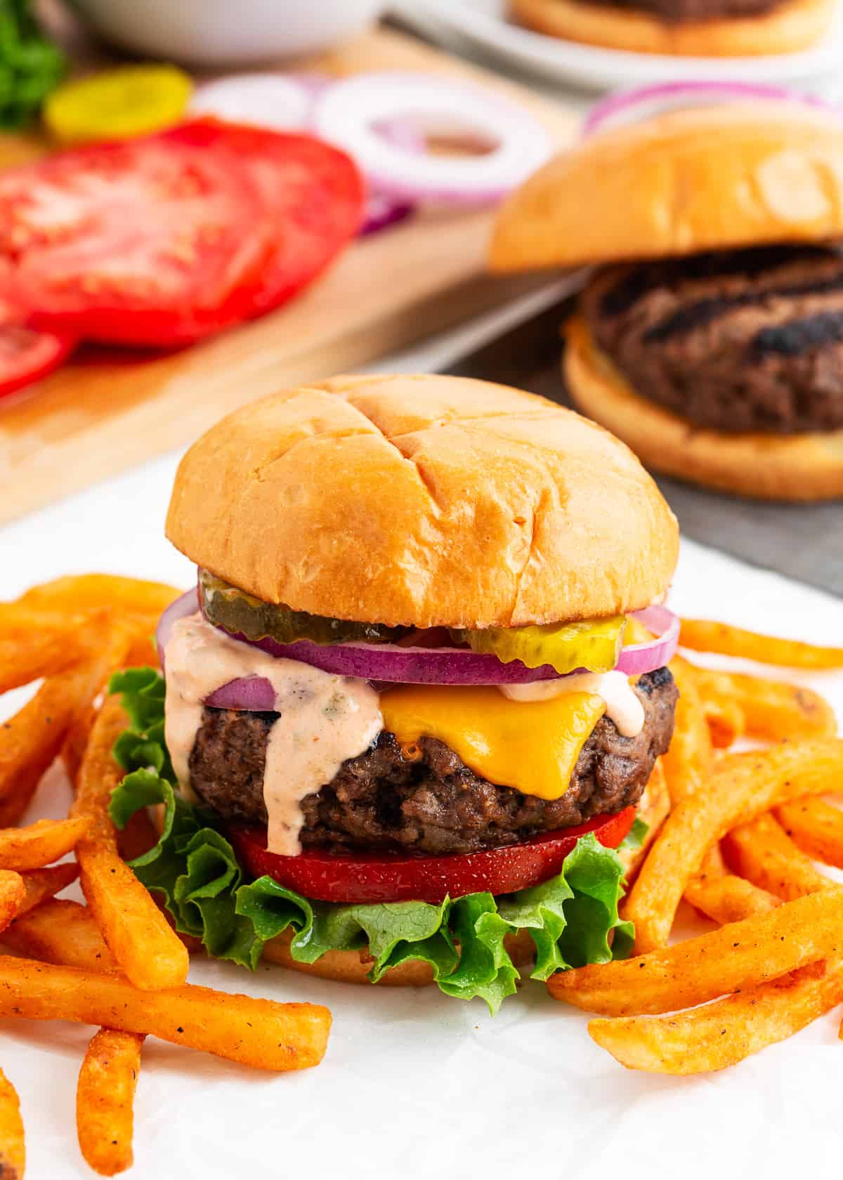 Cheeseburger with fries on a plate. 