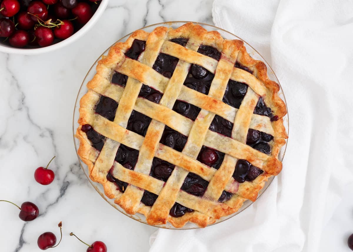 Cherry pie in a glass baking dish.