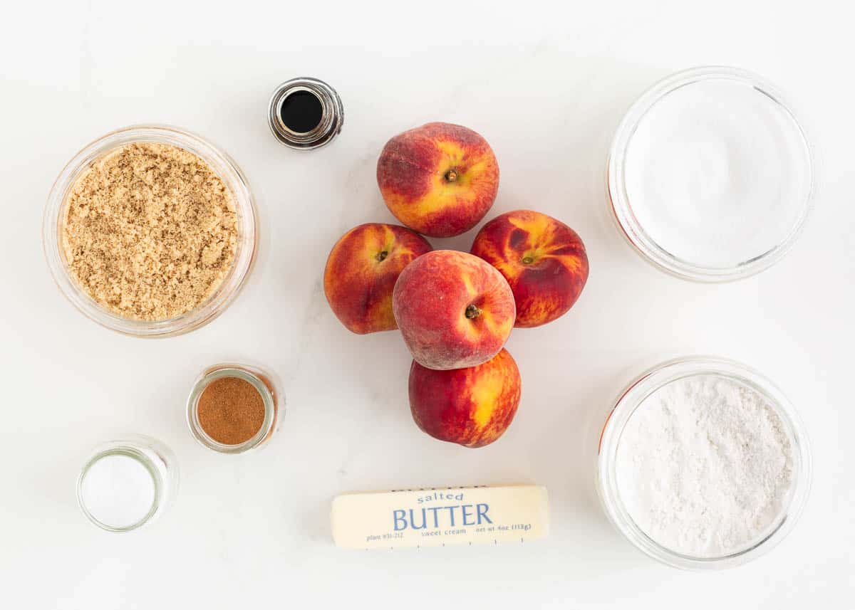 Peach cobbler ingredients on the counter.