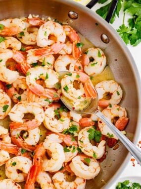 Cooking shrimp scampi in a pot.