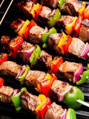 Close up of steak kabobs ready to be taken off the grill.