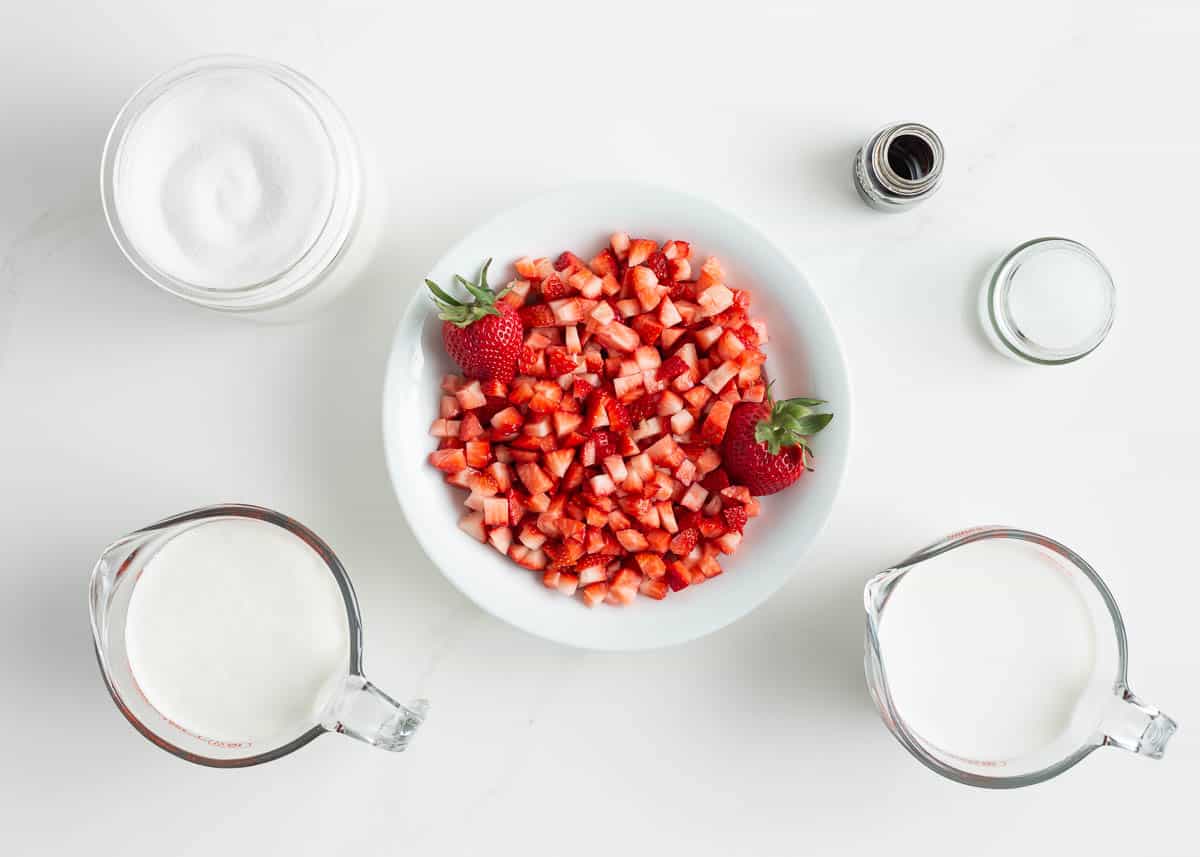 Strawberry ice cream ingredients on the counter.