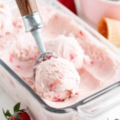 Scooping strawberry ice cream.