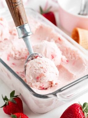 Scooping strawberry ice cream.