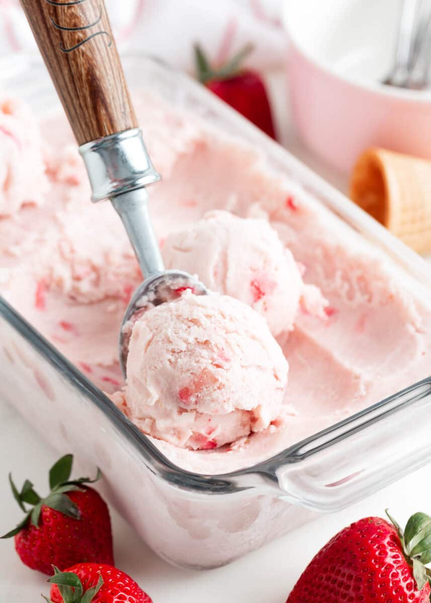 Scooping strawberry ice cream.