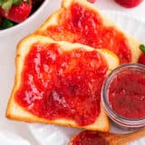 Strawberry rhubarb jam spread on bread.