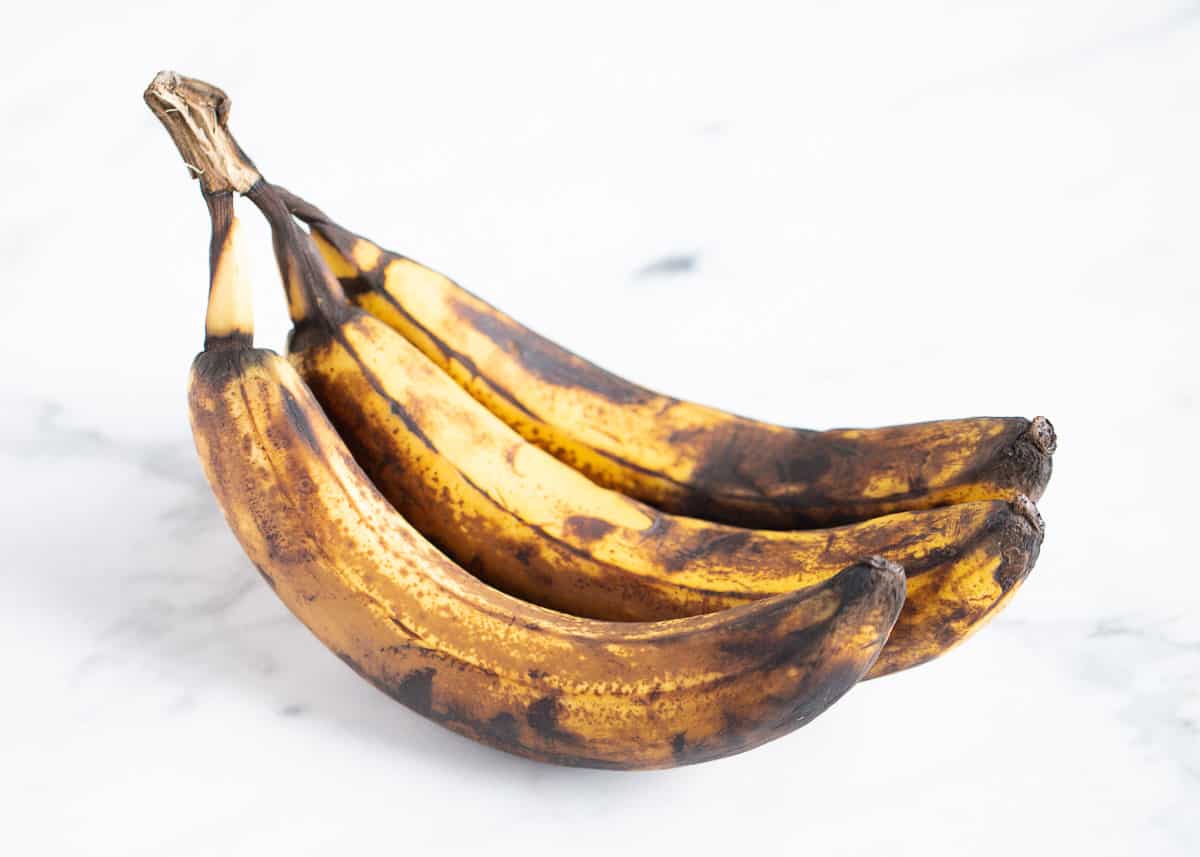 Brown bananas on a counter.