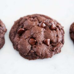 Double chocolate chip cookies on marble countertop.