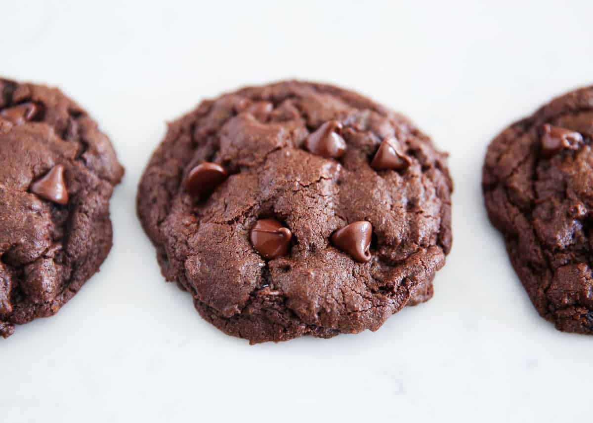 Double chocolate chip cookies on marble countertop.