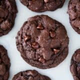 Double chocolate chip cookies on a marble countertop.