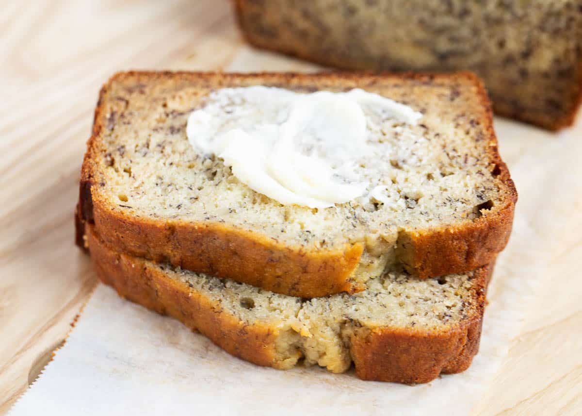 Sliced banana bread with butter. 