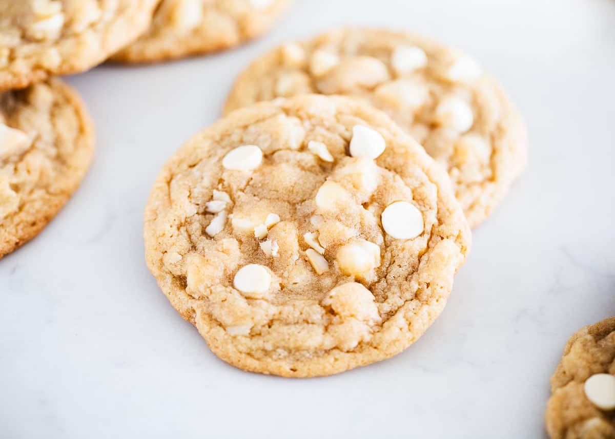 Macadamia nut cookies stacked on each other. 