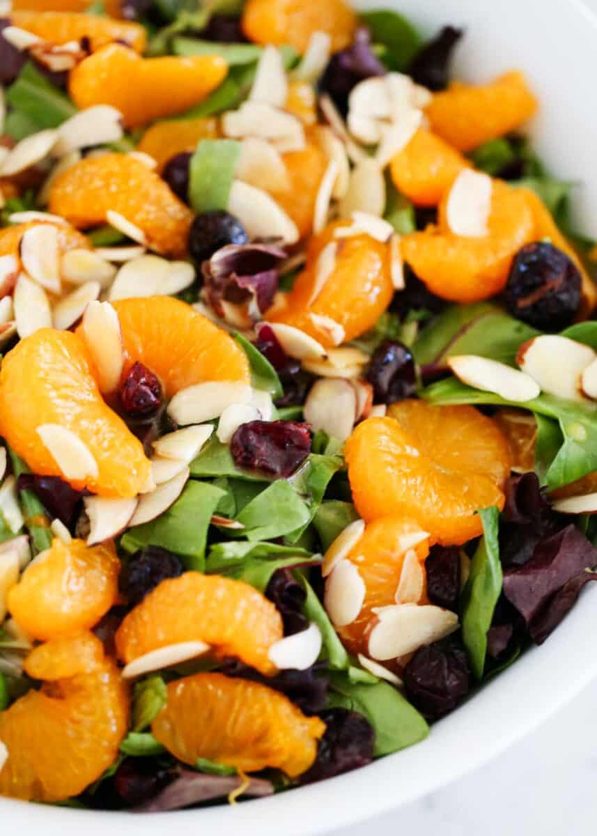 Mandarin orange salad in a white bowl.